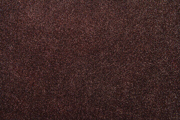 Abstract brown shiny background. Festive dark wallpaper. Holiday. Copy space