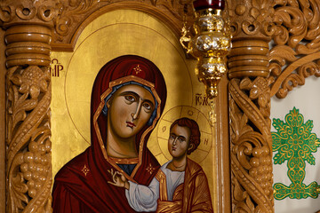 Orthodox icons on a church pulpit. When worshipers enters the church they will kiss this icon and cross themselves.