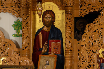 Orthodox icons on a church pulpit. When worshipers enters the church they will kiss this icon and...