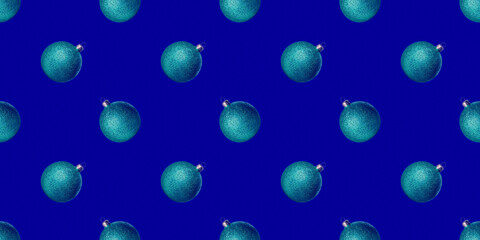 Blue shiny Christmas baubles isolated on blue background New year decorations Glitter ball Minimal composition seamless photo pattern Winter holiday concept Front view flat lay Xmas template Festive