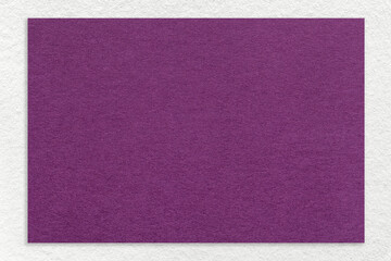 Texture of craft violet color paper background with white border, macro. Vintage dense kraft purple cardboard