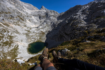 Hiking Pair rest near Kriski Podi middle lake - Julian Alps Slovenia