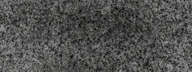Seamless subtle gritty film grain texture photo overlay. Vintage dark black and white speckled noise, grit and grunge background. Abstract fine splattered spray paint particles on paper backdrop