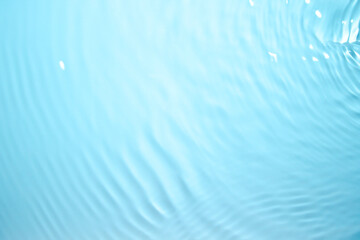 Clear blue natural waves with a shimmer. - obrazy, fototapety, plakaty
