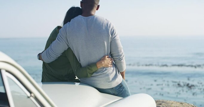 Car, road trip and couple hug at a beach with care, trust and bond in nature rear view together. Travel, freedom and back of man embrace woman at the ocean with love, support and adventure in Florida