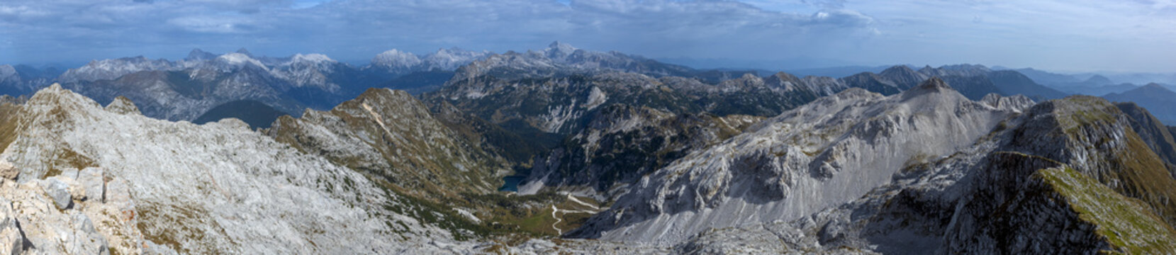 Wide Panoramic View of Triglav national park 180 where we can see Big krn Lake and All mountains of Slovene Julian Alps and much more - View from mount Krn - Slovenia