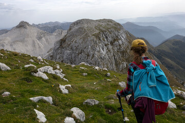 Adult Woman Hiker Hike Between Krn and Batognica Mountain on a very scenic Alpine trail in Julian...