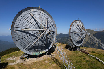 Old data transmission dishes in an abandoned base