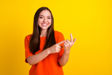 Portrait of girl speak arm fingers count showing explain isolated on yellow color background - obrazy, fototapety, plakaty
