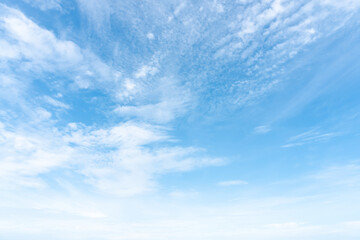 Beautiful blue sky with strange shape of clouds in the morning or evening used as natural background texture in decorative art work - obrazy, fototapety, plakaty