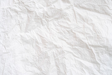 Wrinkled or crumpled white stencil or tissue paper used for crumpled paper background texture.