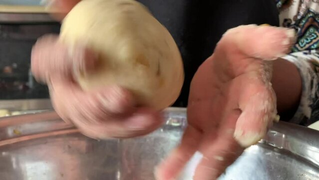 Video of the preparation of "Papa Rellena". traditional Peruvian food made with potatoes. Concept of food.