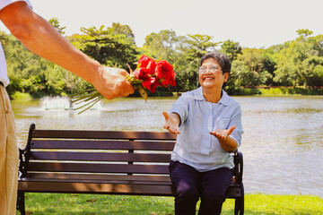 I love you senior asian couple's wedding lasting love anniversary surprise : Elderly husband hides...
