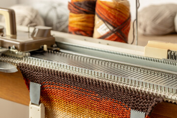 Manual knitting machine. A knitting machine is a device used to create knitted fabrics.