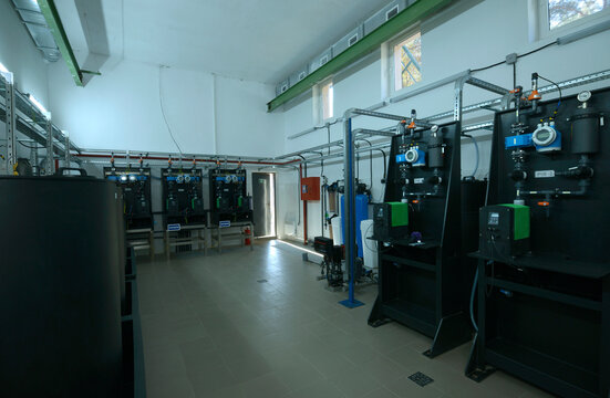 At the dosing systems hall of the water pumping station: sodium hypochlorite storage tanks and dosing system made Grundfos