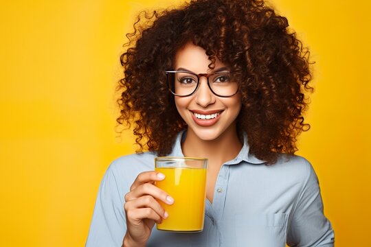 Laughing woman with a stack of orange juice
