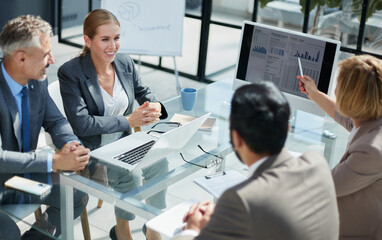 Business people working at desk by windows