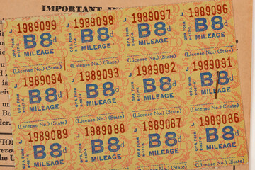 Close up of world war II fuel oil and gas rationing stamps background