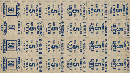 Close up of world war II fuel oil and gas rationing stamps background