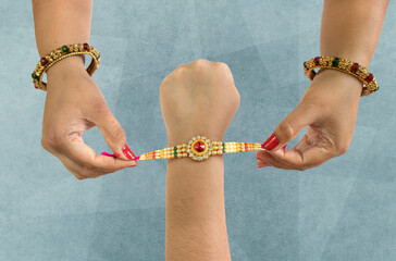 raksha Bandhan A sister is binding rakhi on her brother s hand on the occasion of raksha Bandhan