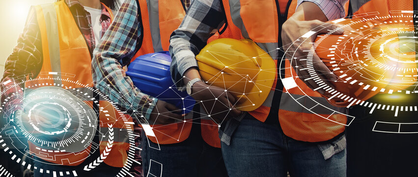 Creating network team engineers men and women workers various nationalities wearing vests standing in line holding safety helmets ensure safety prevent accidents while working in the factory industry. - Powered by Adobe