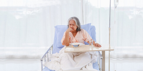Asian elderly woman sick gastritis gastrointestinal disease enter hospital eating bland food...
