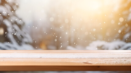 Wooden table top for product display on Christmas and winter theme with pine trees covered with snow and sunlight background