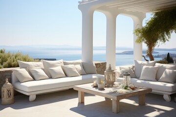 A modern outdoor seating area with a white couch and table