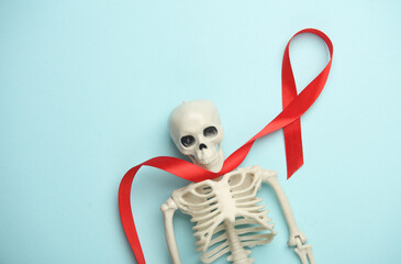 Red AIDS Awareness Ribbon and skeleton on blue Background