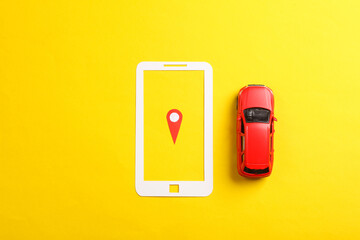 Geolocation Maps Marker point icon in paper cut smartphone with toy cars on yellow background