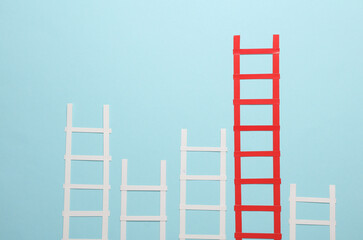 Paper red and white stairs on blue background. Business concept
