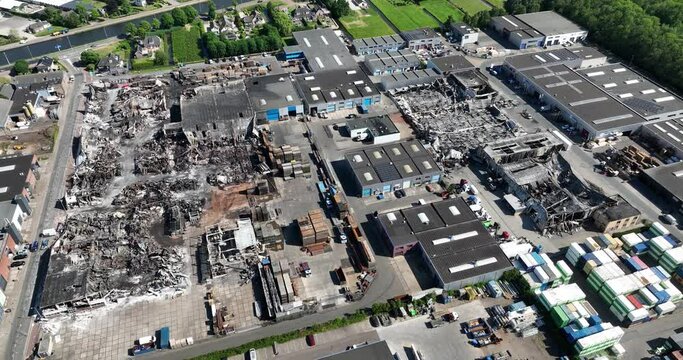 Aerial drone view of the aftermath of a large fire in Ter Aar on an industrial complex.