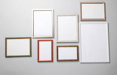 Blank wall frames on a gray background