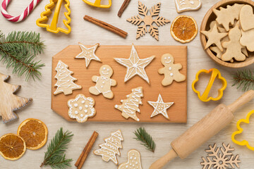 Flat lay with cute homemade Christmas cookies on wooden background,top view