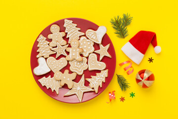 Cute homemade Christmas cookies with decor on color background,top view
