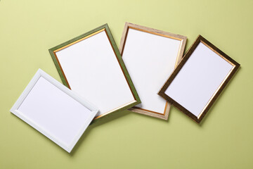 Blank wall frames on green background