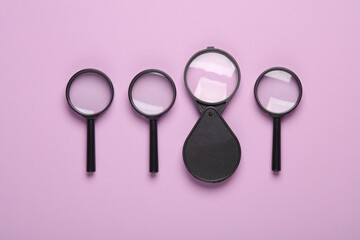 Set of magnifiers on a pink background