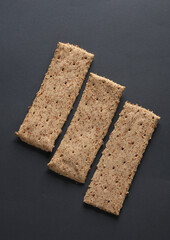 Dietary cereal loaves on a dark gray background. Healthy food concept