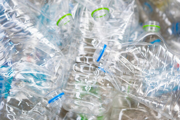 Waste plastic bottles behind in plastic recycling industry. waste management concepts.
