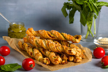 Bread sticks with sesame and tomato with pesto sauce