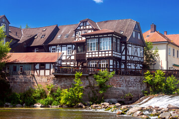 Old half-timbered houses on the banks of a canal in Marburg.