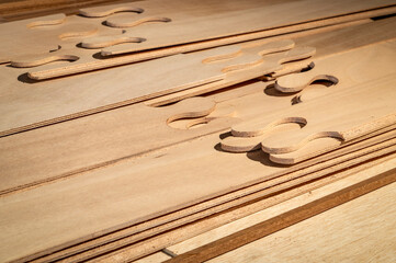 narrow panels of okoume plywood with puzzle joints in stittch-and-glue boat building kit