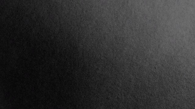 Surface of black paper. Seamless loop rotating. Use for background and texture.