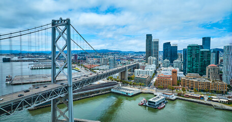 Oakland Bay Bridge aerial with view of city skyscrapers and San Francisco Fire Department Pier
