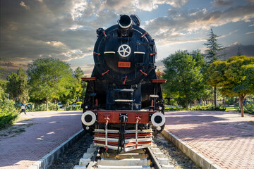 Nostalgic coal-fired steam locomotive exhibited in the garden. Ali Çetinkaya train station, Afyonkarahisar