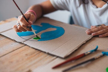 anonymous woman painting Artistic environmental awareness