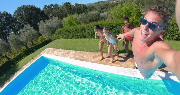 Portrait of Young MultiEthnic Friends Having Fun and Enjoying Their Summer Vacation Together While Swimming in a Pool. Group of Young People Using Smartphone to Film Memories. Screen Replacement