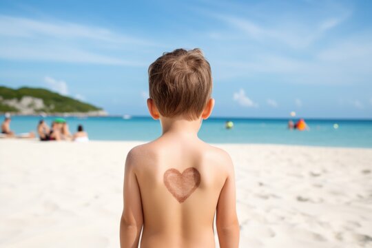 A child with a heart-shaped suntan on his back