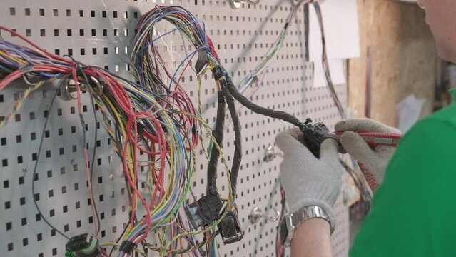 Process of manufacturing the wiring harnesses for vehicles, automobile industry
