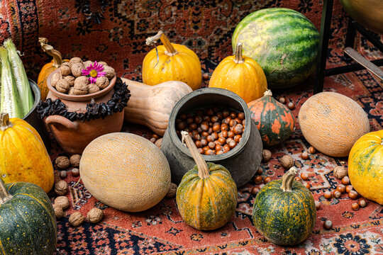 Autumnal harvest on patterned carpet.